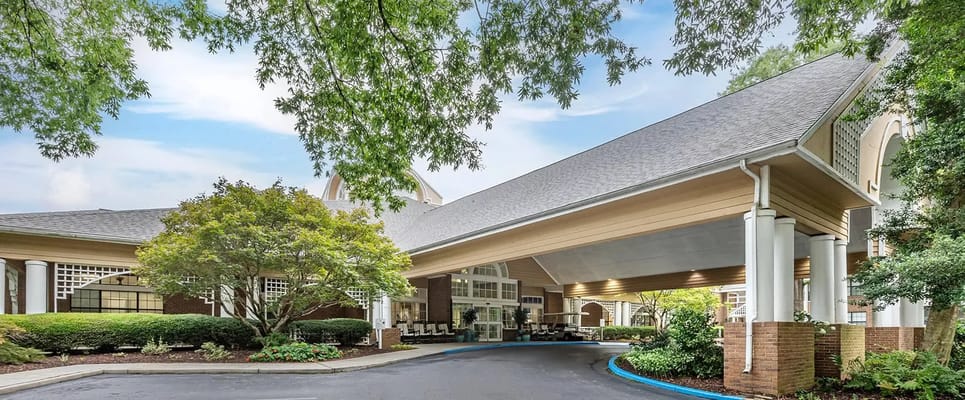 Entryway of a senior living facility with greenery