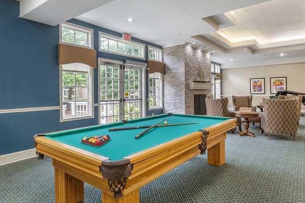 Interior common area with a pool table and seating