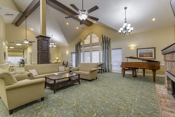 Cozy common area with seating and a piano