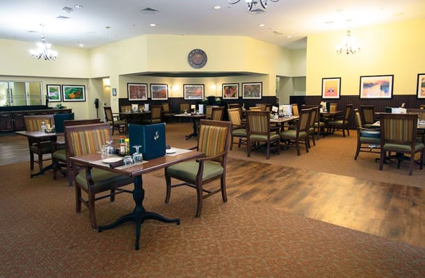 Dining room with tables ready for residents