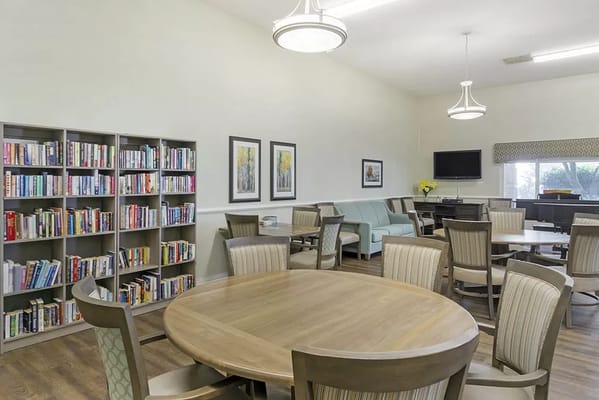 Bright common area with seating and a bookshelf