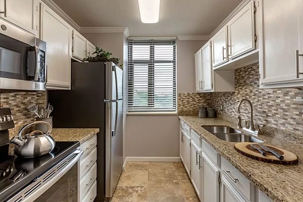 Modern kitchen with granite countertops and stainless appliances