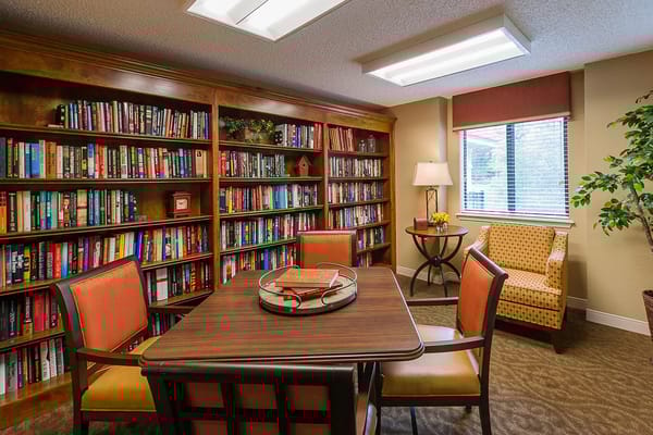 Cozy reading nook with bookshelves and seating