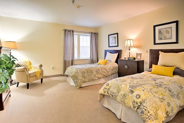 Cozy shared resident room with floral decor