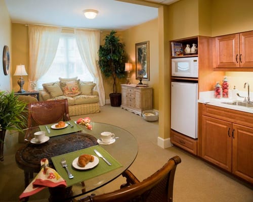 Bright interior of a resident's apartment with food setup