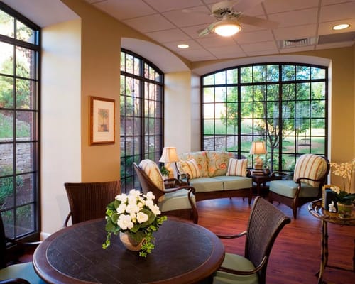 Cozy common area with large windows and comfortable seating