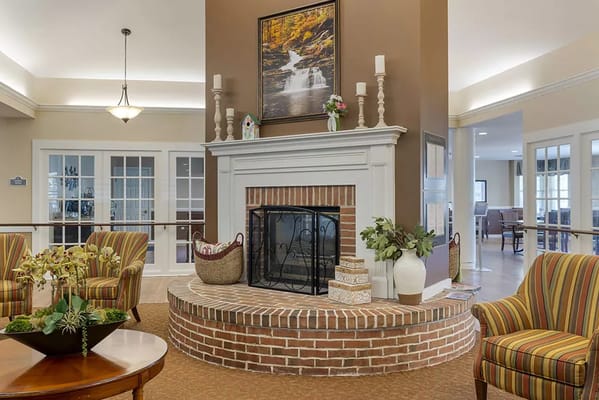 Cozy common area with seating and a fireplace