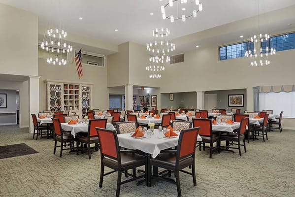 Bright and elegant dining area with tables set for meals