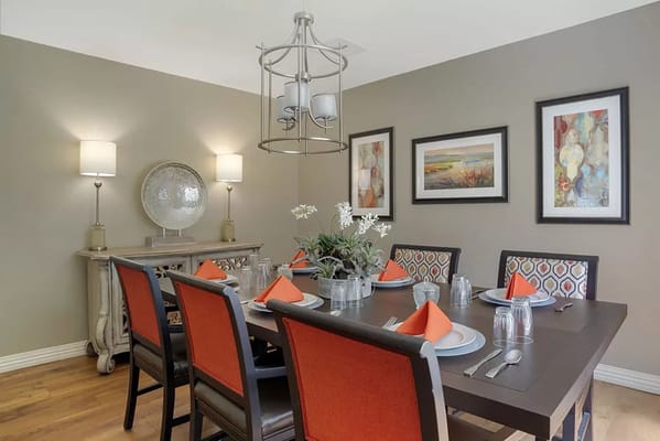 Cozy dining room set up for a meal with decor