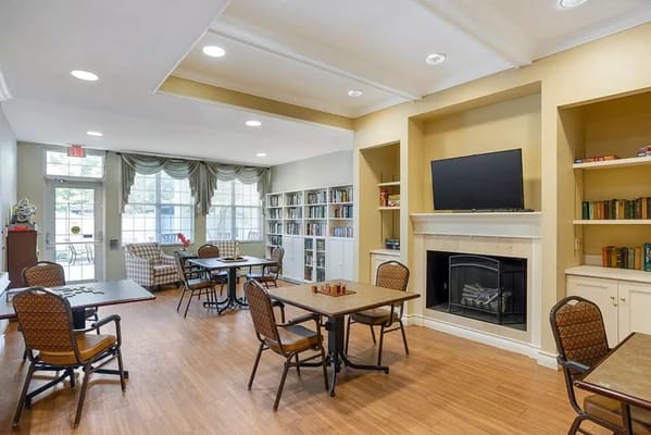 Bright common area with seating and bookshelves