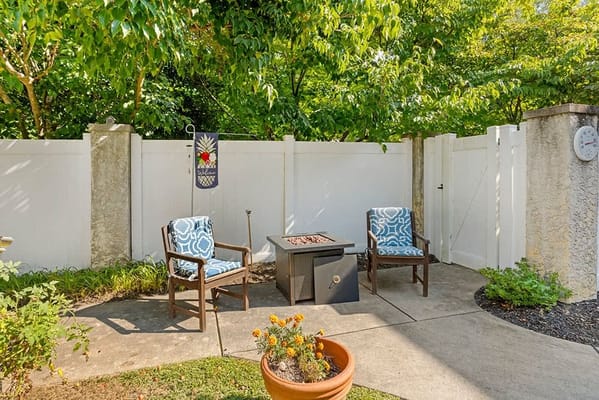 Cozy outdoor seating area with a fire pit and plants