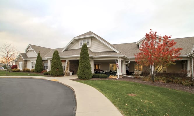 Exterior view of a senior living facility with landscaping