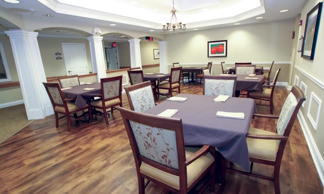 Elegant dining room setup with tables and chairs