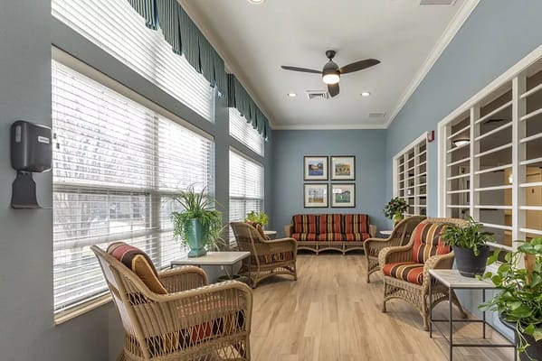 Bright common area with seating and plants