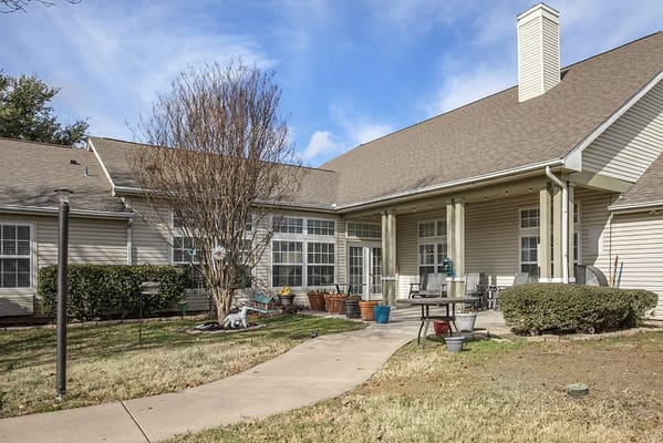 Outdoor area of a senior living facility with garden features