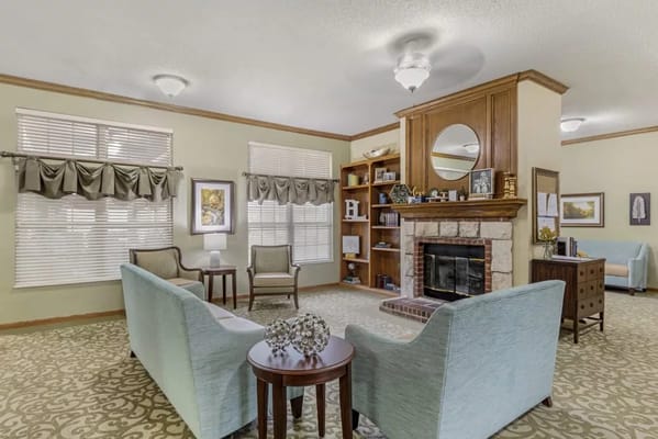 Cozy common area with comfortable seating and a fireplace