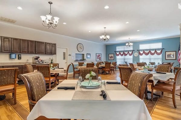 Bright dining room with tables set for meals