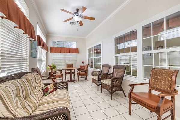 Bright common area with seating and large windows