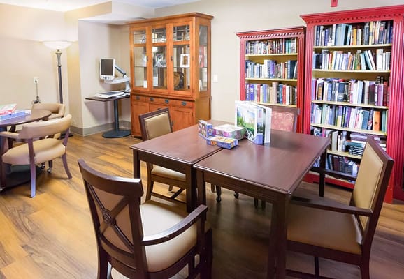 Interior of a common area with bookshelves and furniture