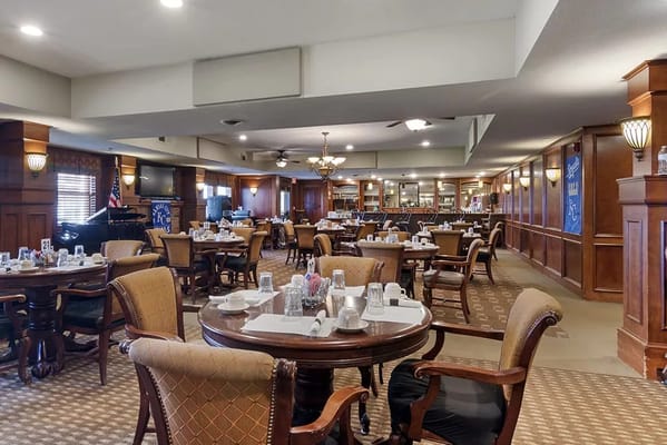 Dining area with tables set for residents