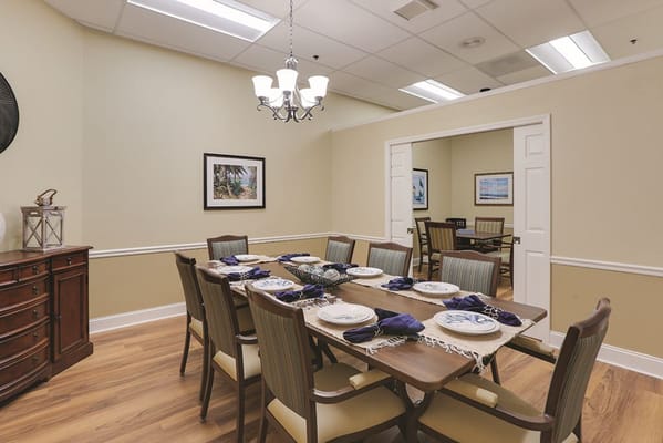 Dining room set for a meal with table settings