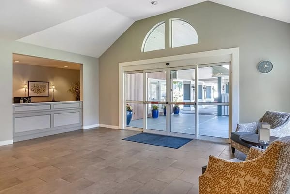 Bright lobby area with seating and reception desk