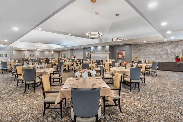 Bright dining room with tables set for meals