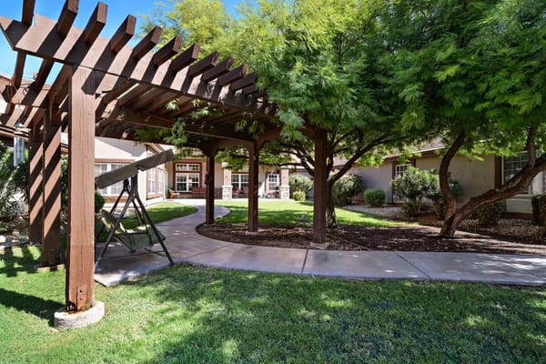 Well-kept garden with shaded seating area