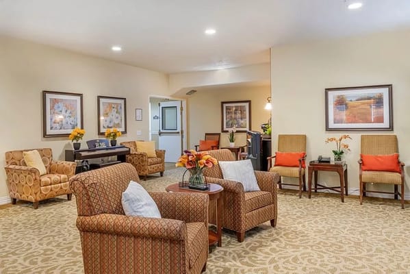 Cozy common area with seating and floral decor