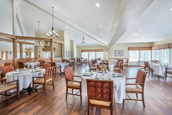 Bright dining room with tables set for meals