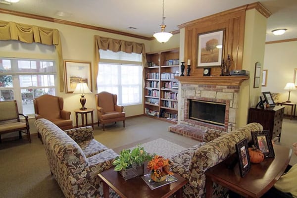 Cozy common area with bookshelves and seating