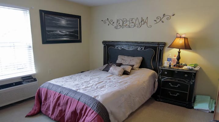 Cozy bedroom setup in a facility room