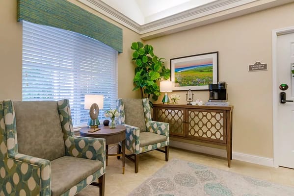 Cozy lobby area with chairs and decor