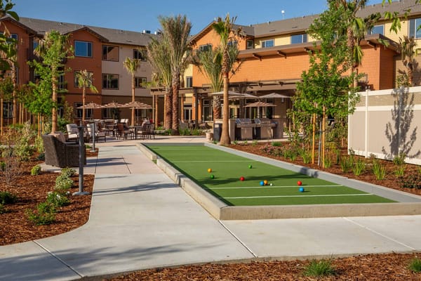 Outdoor bocce ball court with seating areas