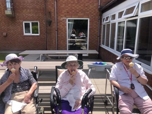 Residents enjoying ice cream in the outdoor area