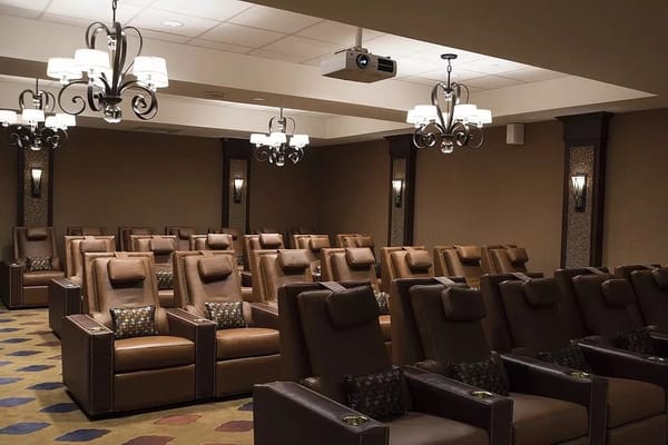 Interior view of a comfortable media room with recliners