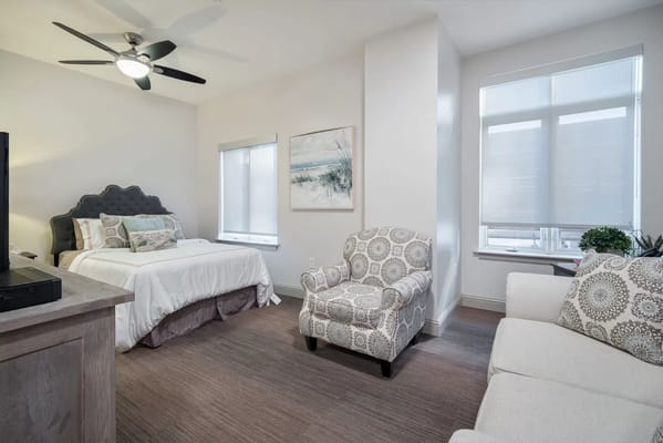 A well-furnished private room in a senior living facility