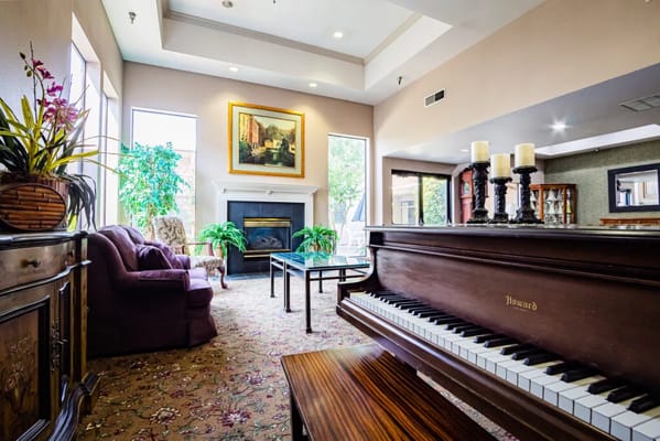 Interior lounge area with piano and seating