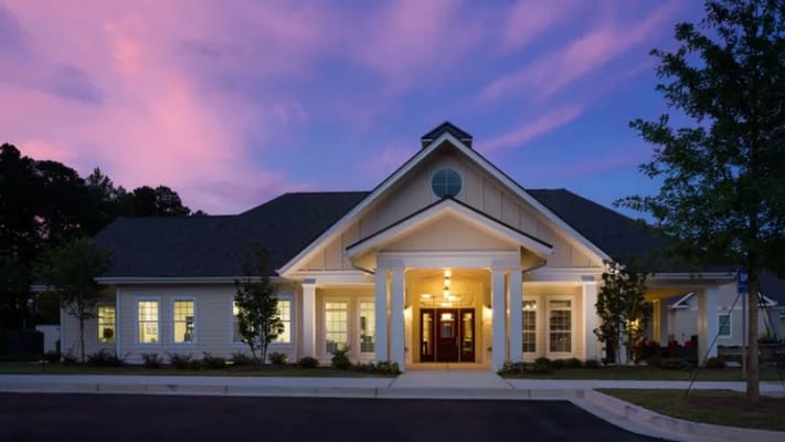 Front entrance of Camellia Place against a twilight sky