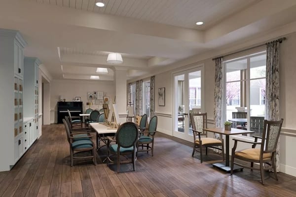 Bright common area with dining and activity spaces at Sunrise of Cupertino