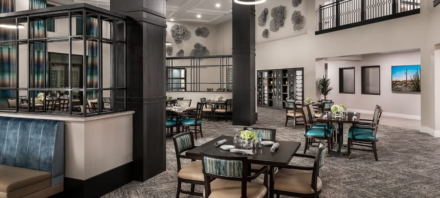 Bright dining room with tables set for meals