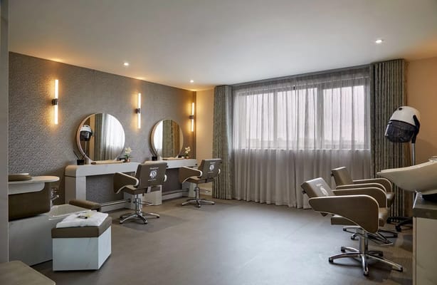 Bright hair salon with styling chairs and mirrors