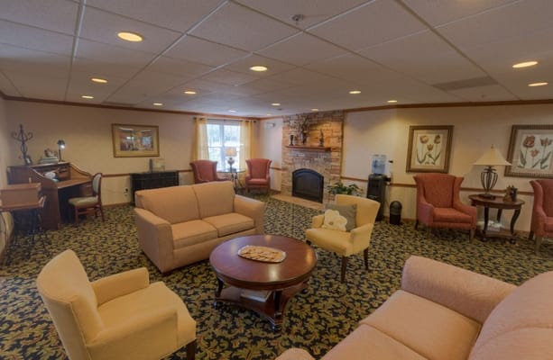 Common area with comfortable seating and a fireplace