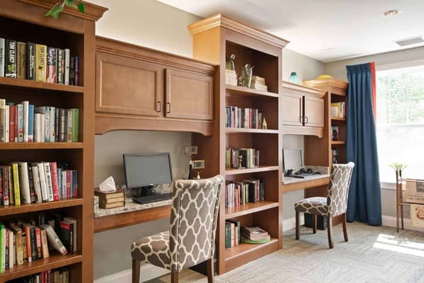 Cozy reading area with bookshelves and chairs