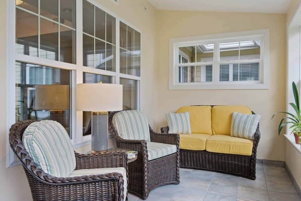 Cozy sunroom with wicker furniture and natural light