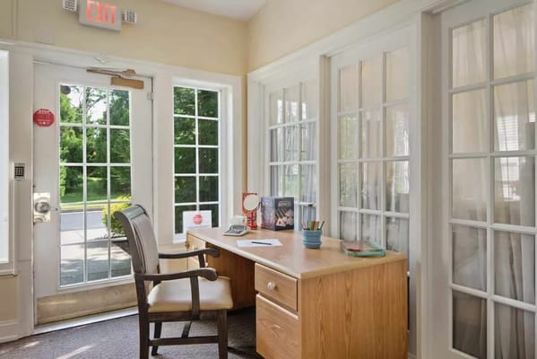 Reception area with desk and large windows