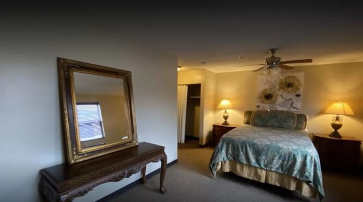 Cozy private bedroom with floral decor and lamps