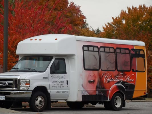 Facility transport vehicle with branding