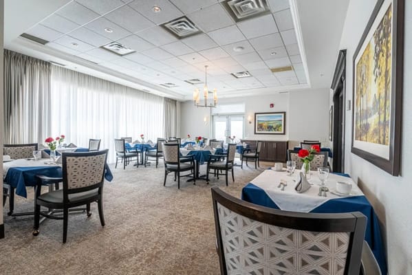 Dining room setup with tables and chairs