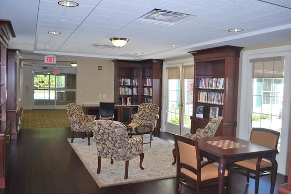 Cozy library space with bookshelves and seating area